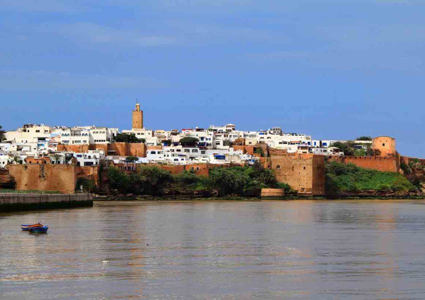 Panoramic view of the historic Udayas Kasbah and its blue-and-white walls overlooking the Atlantic Ocean in Rabat, Morocco